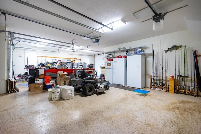 garage with a garage door opener and white fridge