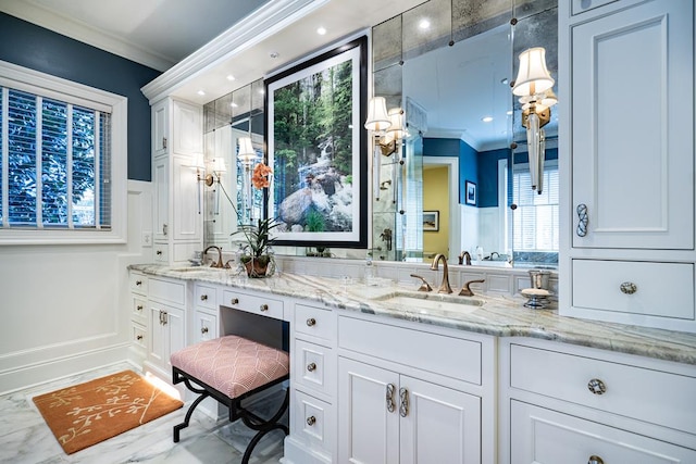 bathroom featuring vanity and ornamental molding