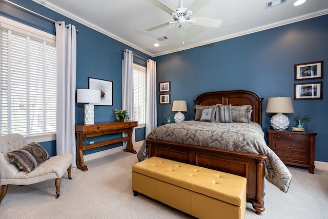 carpeted bedroom with ornamental molding and ceiling fan