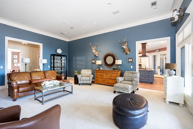 carpeted living room with ornamental molding