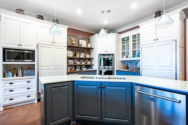 kitchen featuring hanging light fixtures, white cabinetry, ornamental molding, and stainless steel appliances