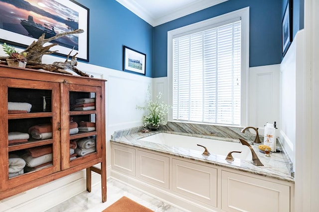 bathroom with crown molding and a tub