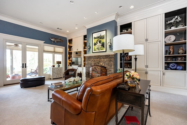 carpeted living room with a stone fireplace, built in features, and ornamental molding