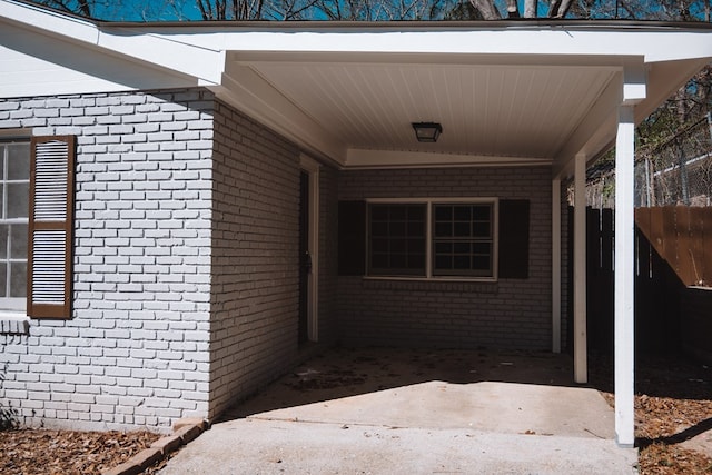 entrance to property with brick siding