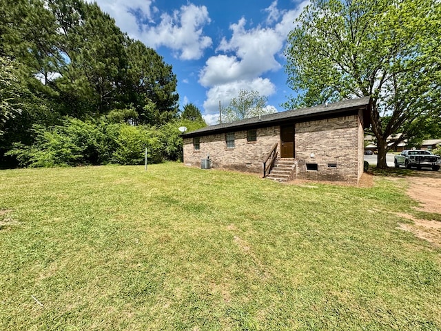107 Mountain View Ct, Hamilton, GA 31811 - view of home's exterior featuring entry steps, a lawn, crawl space, central AC unit, and brick siding
