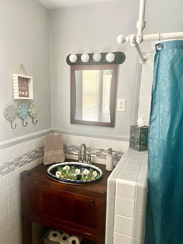 4212 Canady St, Columbus, GA 31909 - bathroom with tile walls, vanity, a wainscoted wall, and curtained shower