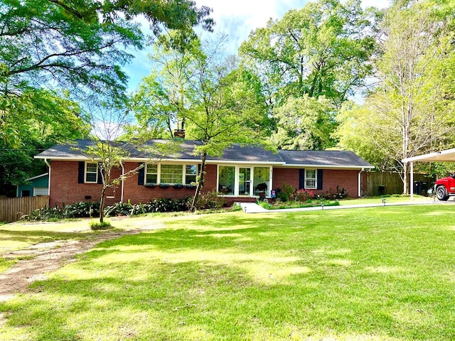 4212 Canady St, Columbus, GA 31909 - ranch-style home with brick siding, a chimney, and a carport