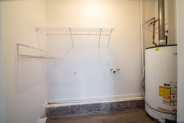 laundry area with water heater