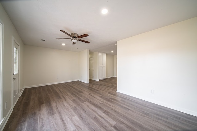 empty room with ceiling fan and hardwood / wood-style floors