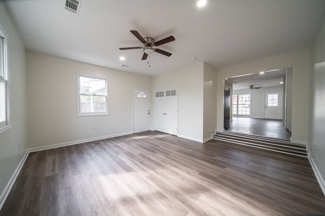 unfurnished room featuring hardwood / wood-style flooring, plenty of natural light, and ceiling fan