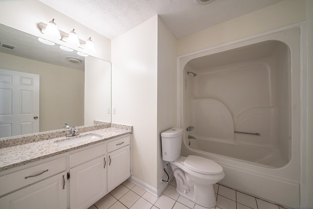 full bathroom featuring tile patterned flooring, vanity, toilet, bathing tub / shower combination, and a textured ceiling