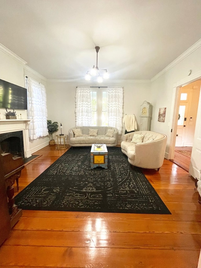 living room with crown molding and wood-type flooring