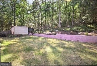 view of yard with a storage unit