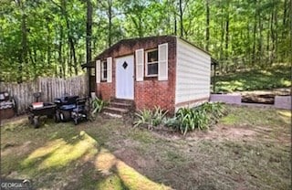 view of outdoor structure with a yard