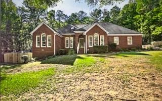 ranch-style house with a front yard