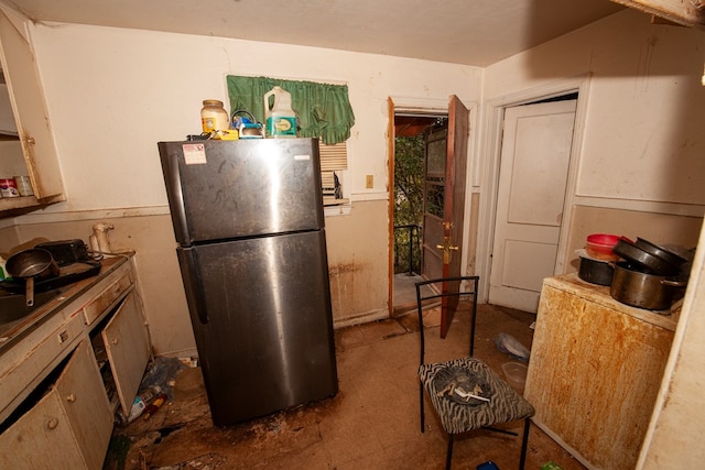 kitchen with freestanding refrigerator