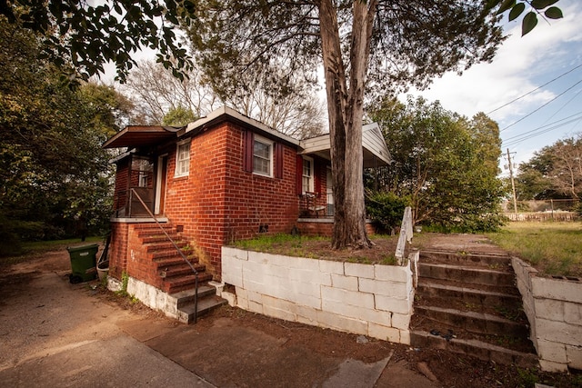 view of home's exterior featuring brick siding