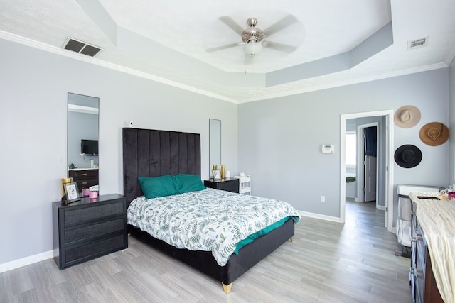 6074 White Pine Dr, Midland, GA 31820 - bedroom featuring a raised ceiling, light wood-style flooring, crown molding, and a ceiling fan