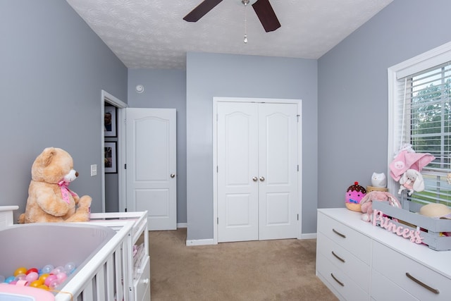 6074 White Pine Dr, Midland, GA 31820 - bedroom with light carpet, a closet, and ceiling fan