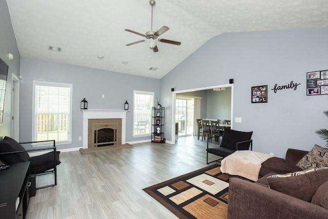 6074 White Pine Dr, Midland, GA 31820 - living room with ceiling fan, light wood-type flooring, a fireplace, and high vaulted ceiling