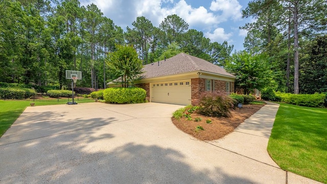 9011 Travelers Way, Midland, GA 31820 - view of home's exterior with brick siding, an attached garage, and driveway