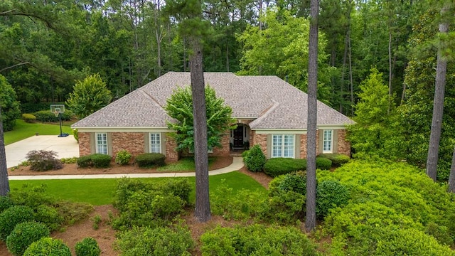 9011 Travelers Way, Midland, GA 31820 - view of front facade with a front yard, brick siding, and roof with shingles