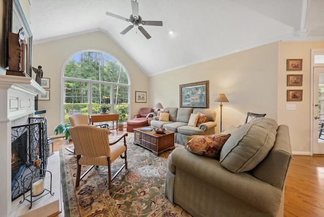 9011 Travelers Way, Midland, GA 31820 - living room with a ceiling fan, wood finished floors, a fireplace, and high vaulted ceiling