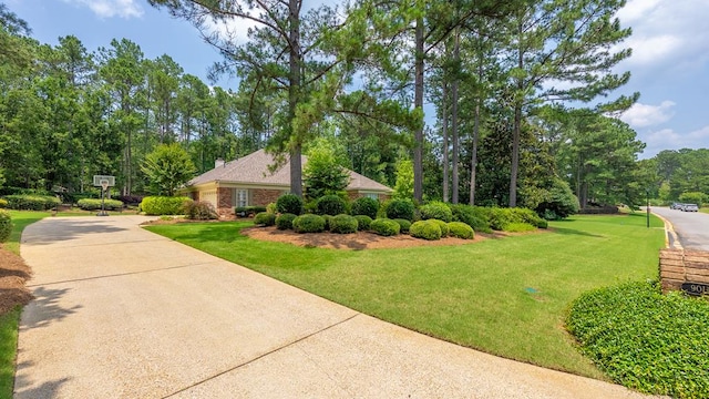 9011 Travelers Way, Midland, GA 31820 - view of front of house featuring a front yard and driveway