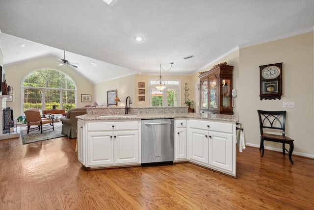 9011 Travelers Way, Midland, GA 31820 - kitchen featuring stainless steel dishwasher, a sink, light wood-type flooring, open floor plan, and healthy amount of natural light