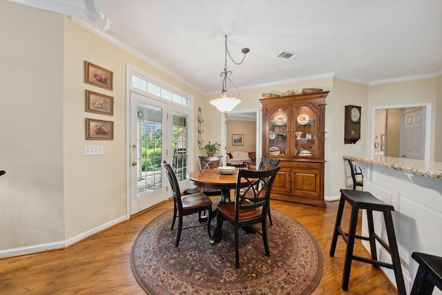 9011 Travelers Way, Midland, GA 31820 - dining room featuring ornamental molding, baseboards, and light wood-style flooring