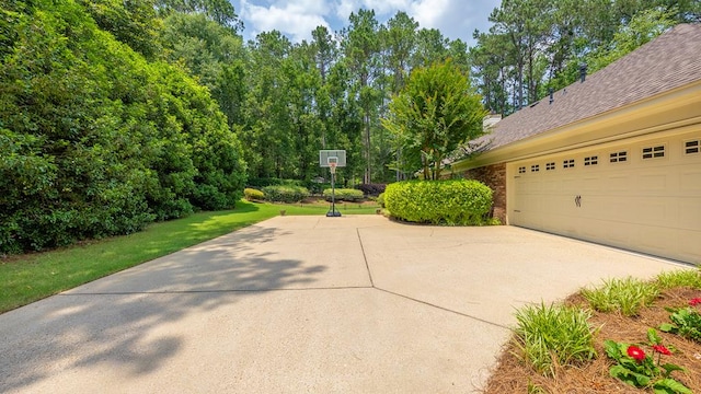 9011 Travelers Way, Midland, GA 31820 - view of side of home with driveway, brick siding, and a garage