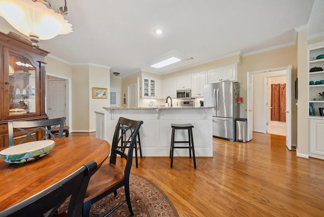 9011 Travelers Way, Midland, GA 31820 - dining area featuring ornamental molding, light wood finished floors, baseboards, and recessed lighting