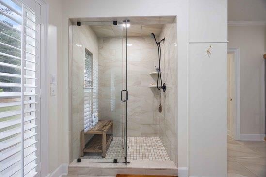 219 Broken Rock Rd, Hamilton, GA 31811 - bathroom with a stall shower, tile patterned flooring, and crown molding
