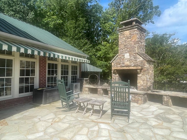 219 Broken Rock Rd, Hamilton, GA 31811 - view of patio featuring an outdoor stone fireplace