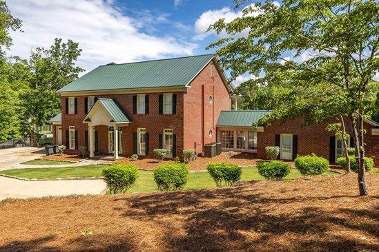 219 Broken Rock Rd, Hamilton, GA 31811 - rear view of property featuring a metal roof and a standing seam roof