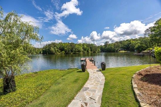 219 Broken Rock Rd, Hamilton, GA 31811 - dock area with a yard, a water view, and a view of trees