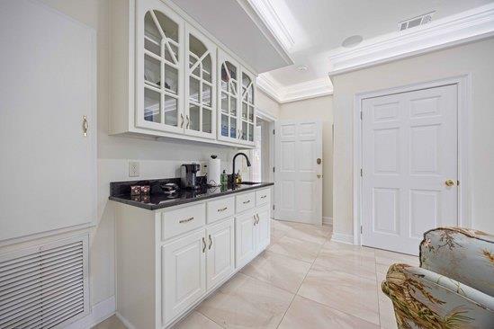 219 Broken Rock Rd, Hamilton, GA 31811 - bar area featuring a sink and crown molding