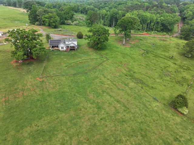 birds eye view of property with a rural view