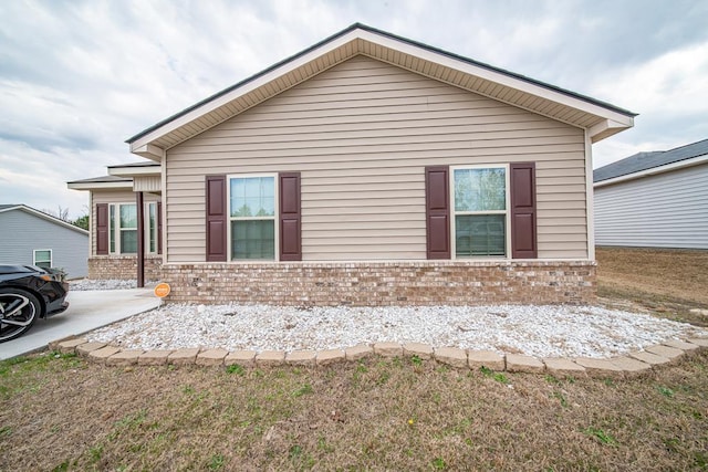 view of home's exterior featuring brick siding