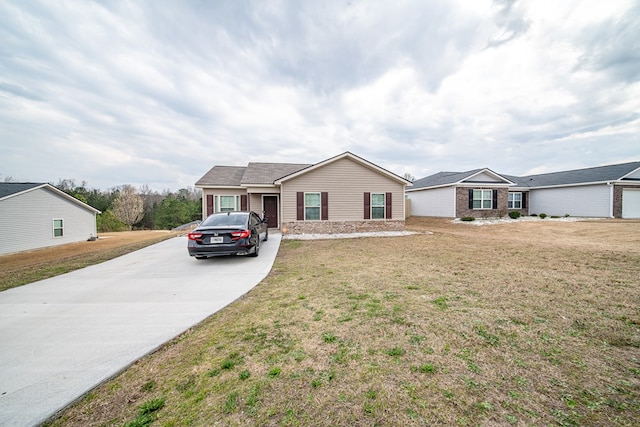 ranch-style house with brick siding and a front yard