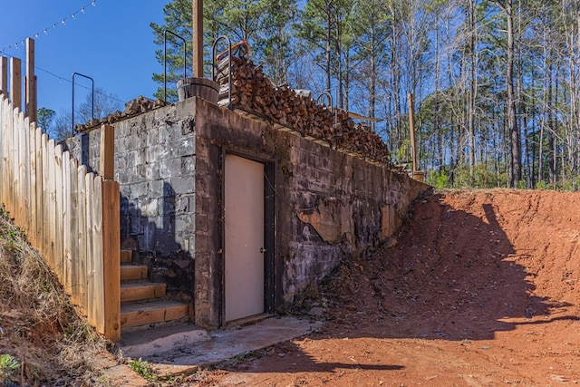 view of home's exterior with fence