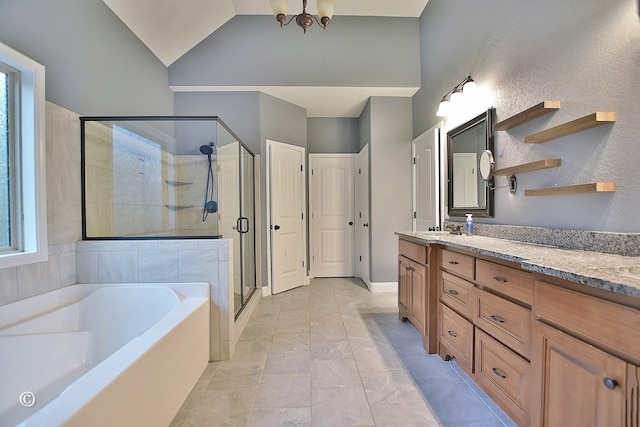 bathroom featuring vanity, plus walk in shower, lofted ceiling, and an inviting chandelier