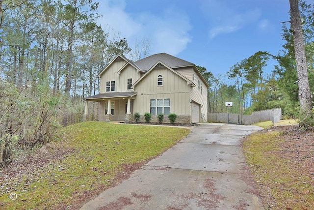 view of front of property with a front yard and a garage