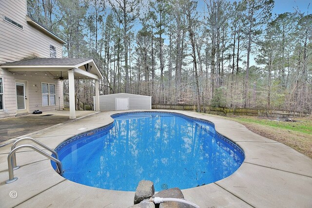 view of pool featuring a patio and ceiling fan