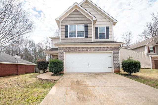 front facade featuring a garage and a front lawn