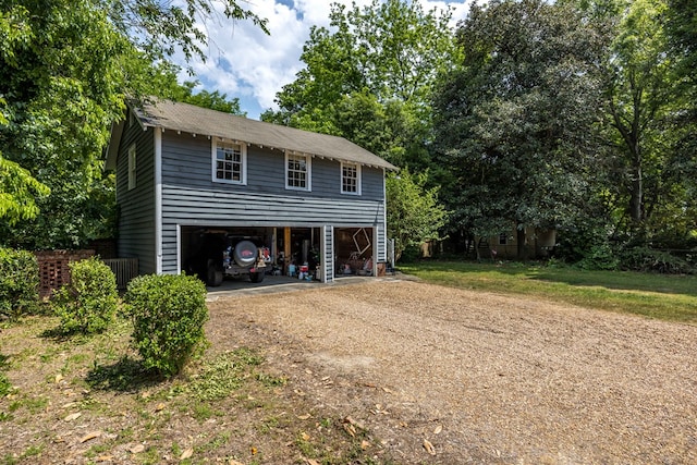 exterior space with driveway and a carport