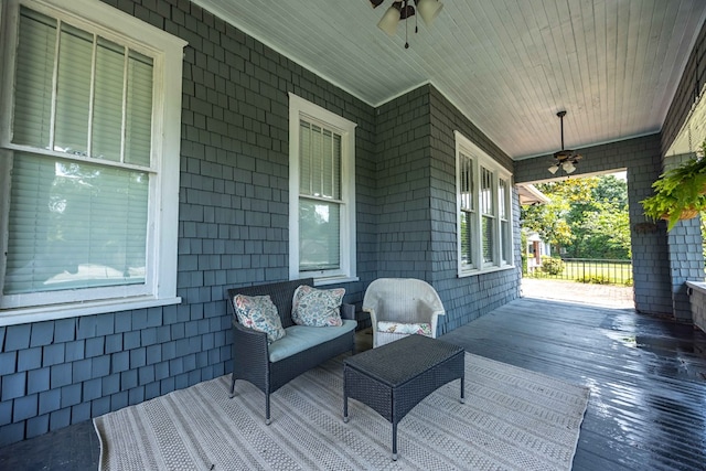 deck featuring a porch, outdoor lounge area, and a ceiling fan