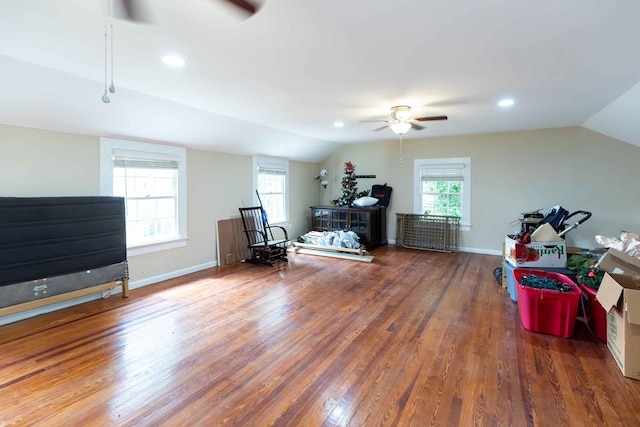 interior space with a ceiling fan, vaulted ceiling, wood finished floors, and recessed lighting