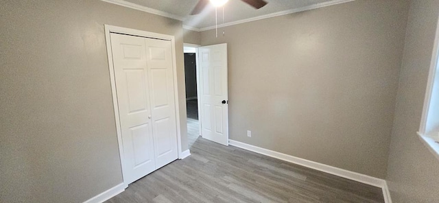 3315 Urban Ave, Columbus, GA 31907 - unfurnished bedroom with crown molding, wood finished floors, a closet, and ceiling fan
