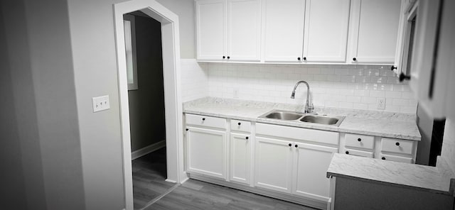 3315 Urban Ave, Columbus, GA 31907 - kitchen featuring decorative backsplash, wood finished floors, white cabinets, and light stone counters